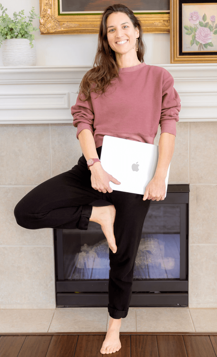 Standing with a laptop